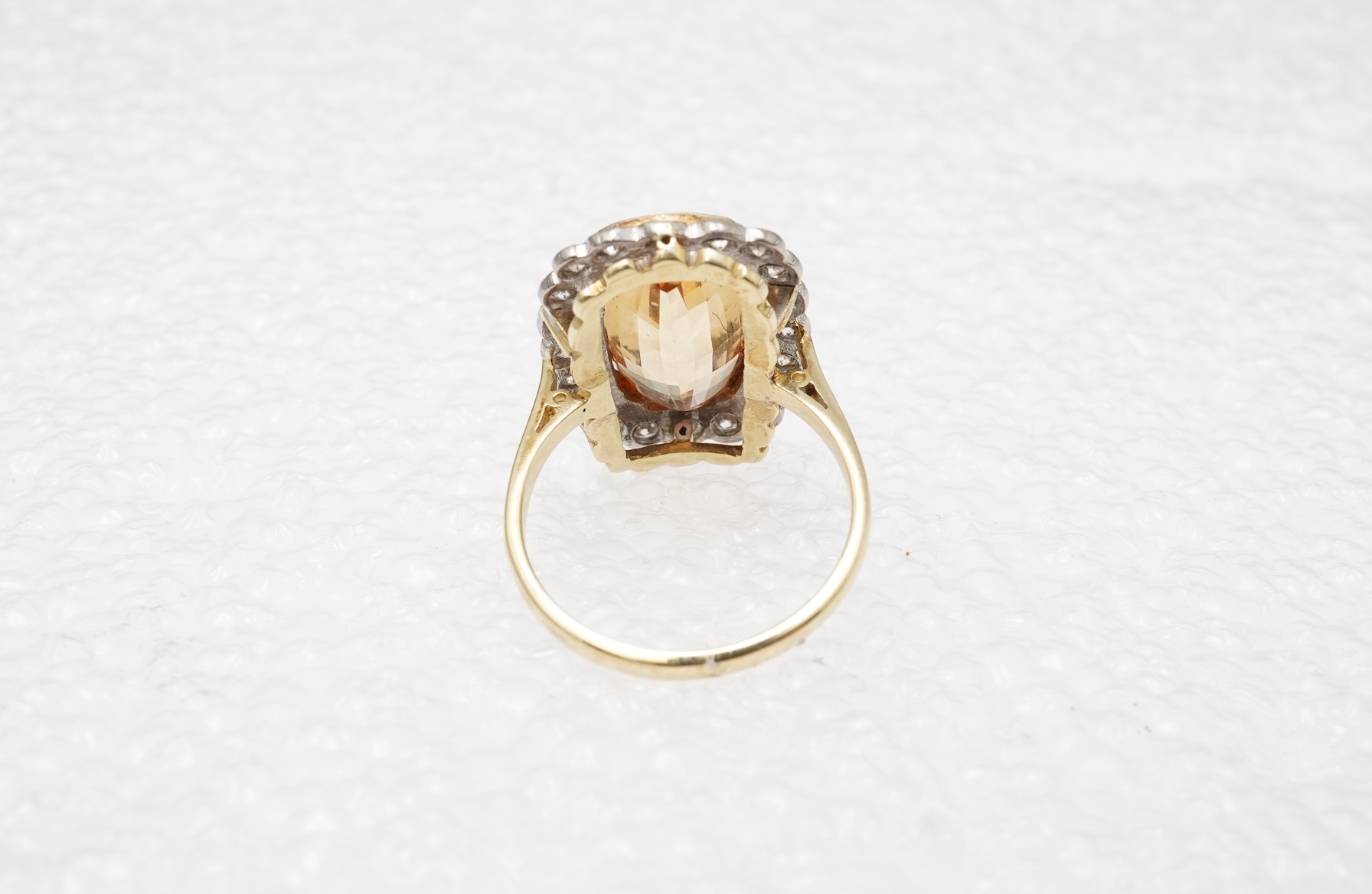 A topaz and diamond cluster ring